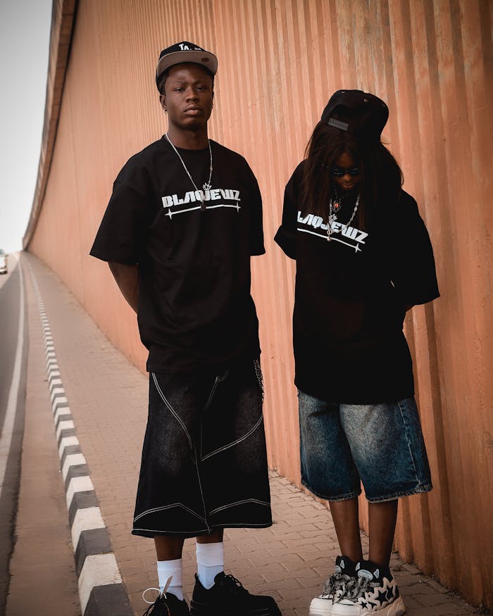pexels photo 36084095 Two young adults showcasing urban streetwear in a cityscape.